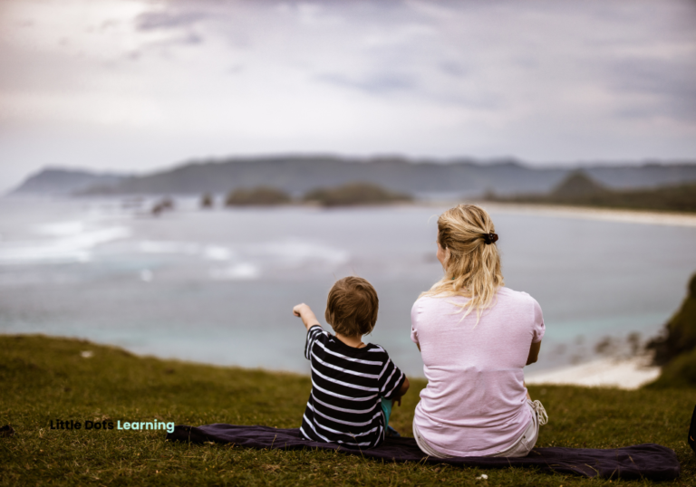 Mommy and son photo facing the shore and nature.